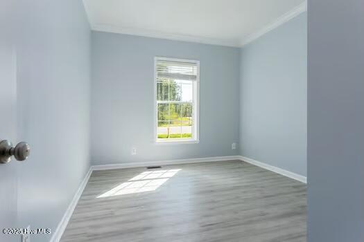 225 Factory Rd, Hampstead, NC 28443 - empty room with ornamental molding, wood finished floors, and baseboards