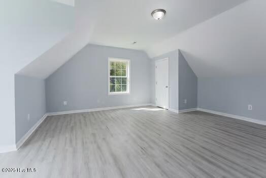 225 Factory Rd, Hampstead, NC 28443 - additional living space featuring wood finished floors, lofted ceiling, and baseboards