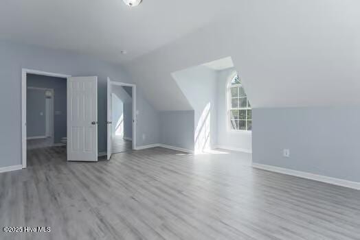 225 Factory Rd, Hampstead, NC 28443 - additional living space featuring wood finished floors, baseboards, and lofted ceiling