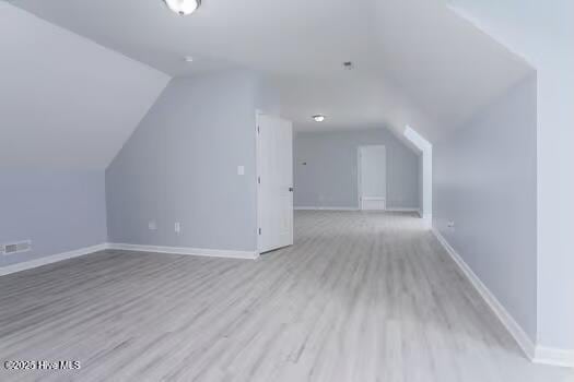225 Factory Rd, Hampstead, NC 28443 - bonus room featuring lofted ceiling, wood finished floors, and baseboards