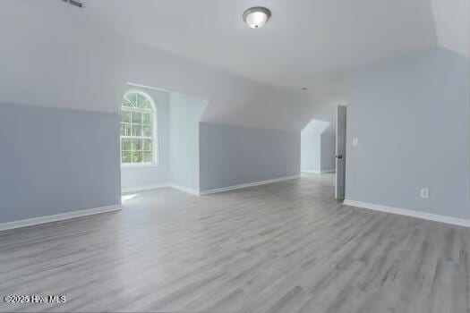 225 Factory Rd, Hampstead, NC 28443 - additional living space with vaulted ceiling, wood finished floors, and baseboards