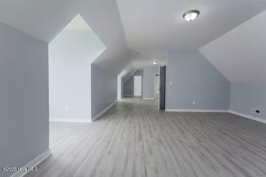 225 Factory Rd, Hampstead, NC 28443 - bonus room with wood finished floors, baseboards, and vaulted ceiling