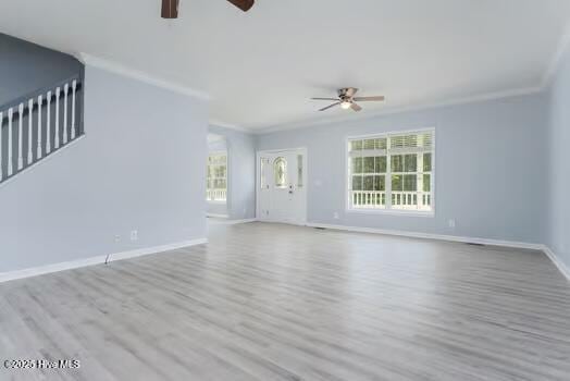 225 Factory Rd, Hampstead, NC 28443 - unfurnished living room with ceiling fan, wood finished floors, crown molding, and baseboards
