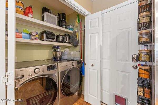 1135 Sunburst Way, Leland, NC 28451 - washroom with separate washer and dryer and wood finished floors
