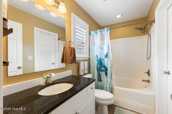 1135 Sunburst Way, Leland, NC 28451 - bathroom with vanity, toilet, and shower / bath combo with shower curtain