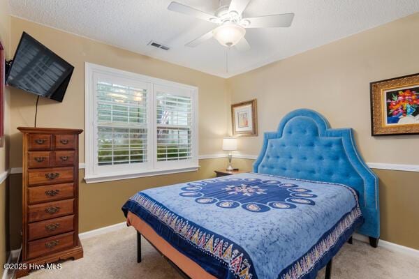1135 Sunburst Way, Leland, NC 28451 - bedroom featuring carpet flooring, baseboards, a textured ceiling, and ceiling fan