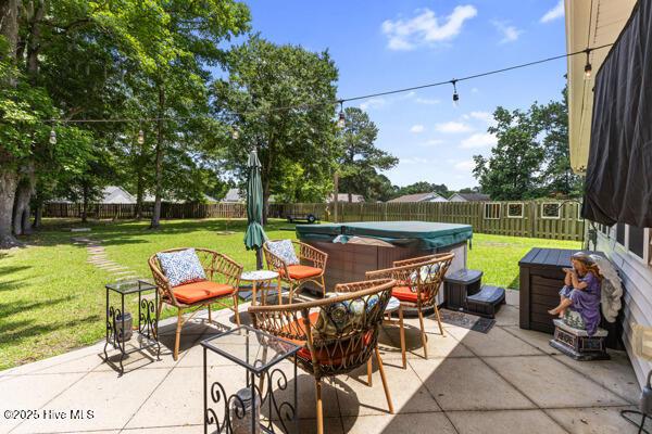 1135 Sunburst Way, Leland, NC 28451 - view of patio featuring a hot tub
