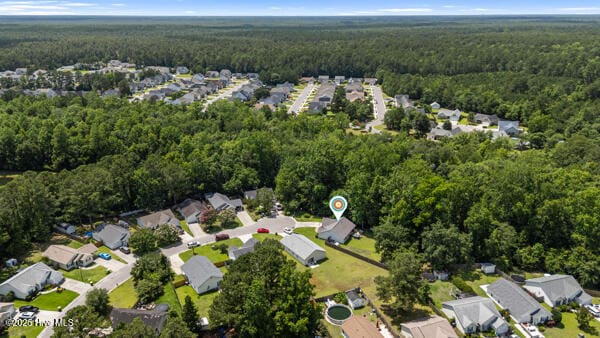 1135 Sunburst Way, Leland, NC 28451 - aerial view of property's location featuring a forest and nearby suburban area