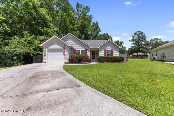 1135 Sunburst Way, Leland, NC 28451 - ranch-style house featuring a front lawn, concrete driveway, and an attached garage