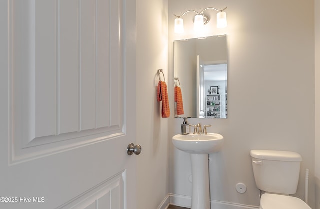 522 Heartwood Dr, Leland, NC 28479 - bathroom featuring toilet and a sink
