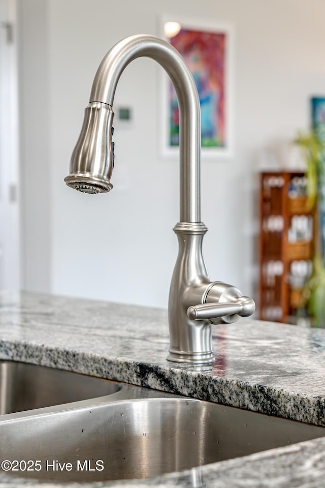 522 Heartwood Dr, Leland, NC 28479 - kitchen view of a sink and stone counters