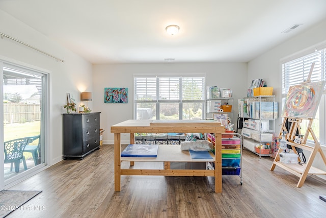 522 Heartwood Dr, Leland, NC 28479 - dining space with healthy amount of natural light, wood finished floors, and baseboards