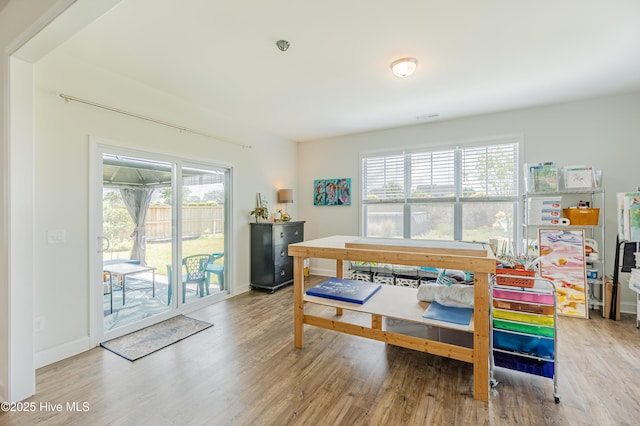 522 Heartwood Dr, Leland, NC 28479 - dining space with wood finished floors, healthy amount of natural light, and baseboards