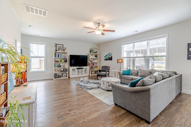 522 Heartwood Dr, Leland, NC 28479 - living room with ceiling fan, wood finished floors, and baseboards