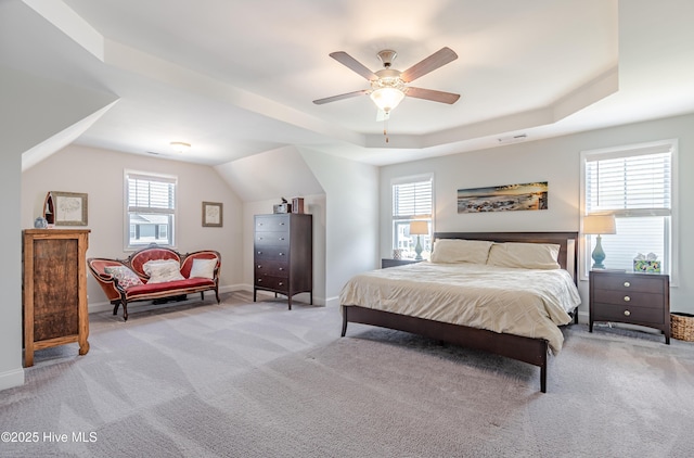 522 Heartwood Dr, Leland, NC 28479 - bedroom featuring light carpet, multiple windows, and a raised ceiling