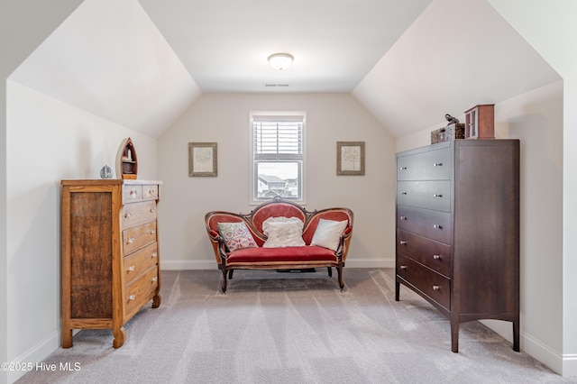 522 Heartwood Dr, Leland, NC 28479 - sitting room featuring vaulted ceiling, light carpet, and baseboards