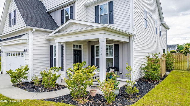 522 Heartwood Dr, Leland, NC 28479 - view of property exterior with a garage, a porch, and a shingled roof