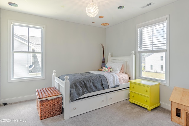 522 Heartwood Dr, Leland, NC 28479 - bedroom with multiple windows, light colored carpet, and baseboards