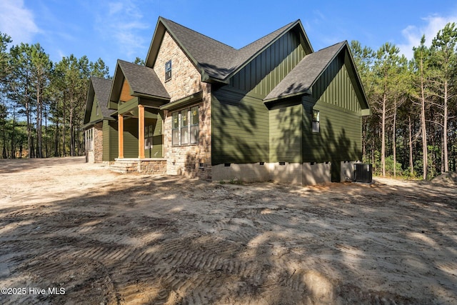 445 Oldham Rd, West End, NC 27376 - view of property exterior with crawl space, stone siding, roof with shingles, and board and batten siding