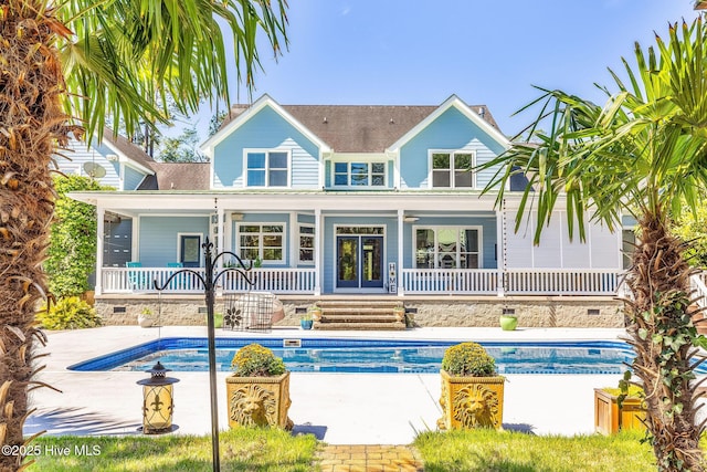 414 Yaupon Dr, Southport, NC 28461 - back of property featuring covered porch, an outdoor pool, and crawl space