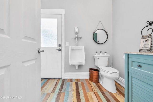 414 Yaupon Dr, Southport, NC 28461 - half bath featuring toilet, wood finished floors, vanity, and baseboards