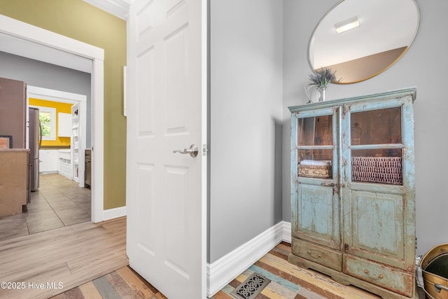 414 Yaupon Dr, Southport, NC 28461 - corridor featuring light wood-type flooring and baseboards