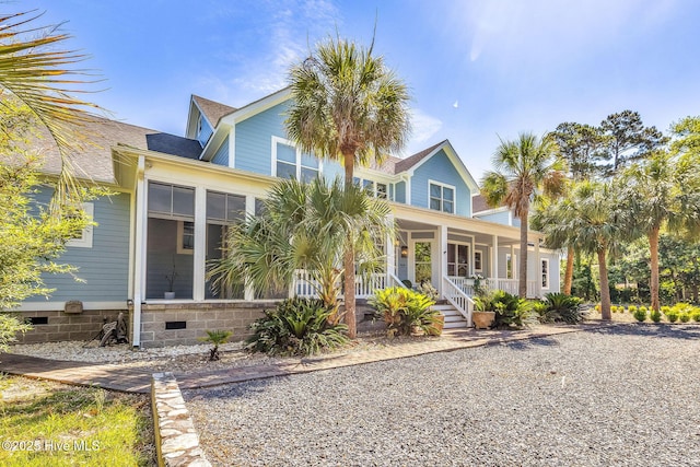 414 Yaupon Dr, Southport, NC 28461 - view of front facade featuring a porch and crawl space
