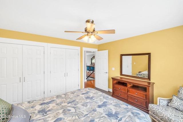 414 Yaupon Dr, Southport, NC 28461 - bedroom featuring two closets, a ceiling fan, and carpet floors