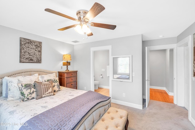 414 Yaupon Dr, Southport, NC 28461 - carpeted bedroom featuring baseboards, ceiling fan, and connected bathroom