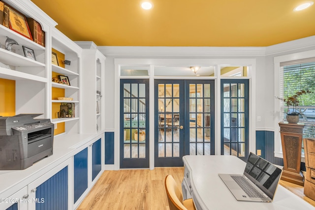 414 Yaupon Dr, Southport, NC 28461 - office area featuring french doors, light wood-style flooring, built in shelves, and crown molding