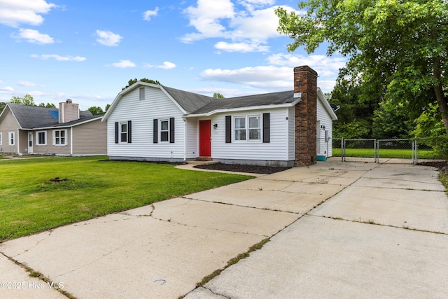 453 Hunting Green Dr, Jacksonville, NC 28546 - view of front of property with a chimney, a gate, driveway, and a shingled roof