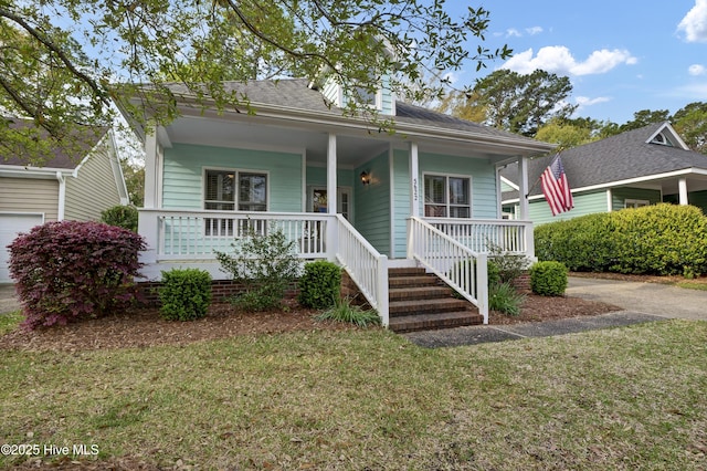 5622 Shell Road Village Dr, Wilmington, NC 28403 - view of front facade featuring covered porch and a front yard