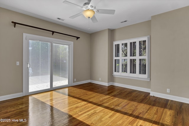 5622 Shell Road Village Dr, Wilmington, NC 28403 - unfurnished room with wood finished floors, ceiling fan, and baseboards