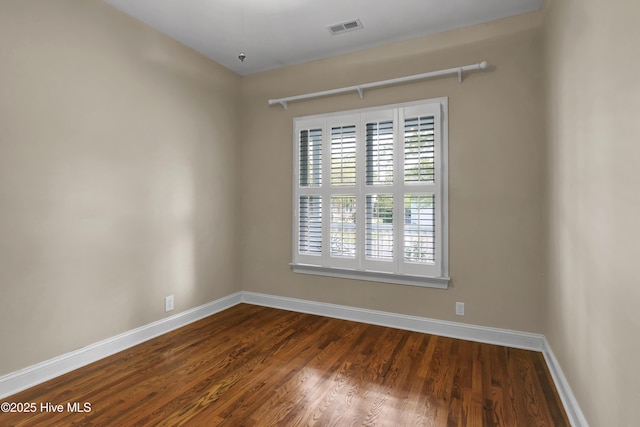5622 Shell Road Village Dr, Wilmington, NC 28403 - unfurnished room featuring baseboards and dark wood-type flooring