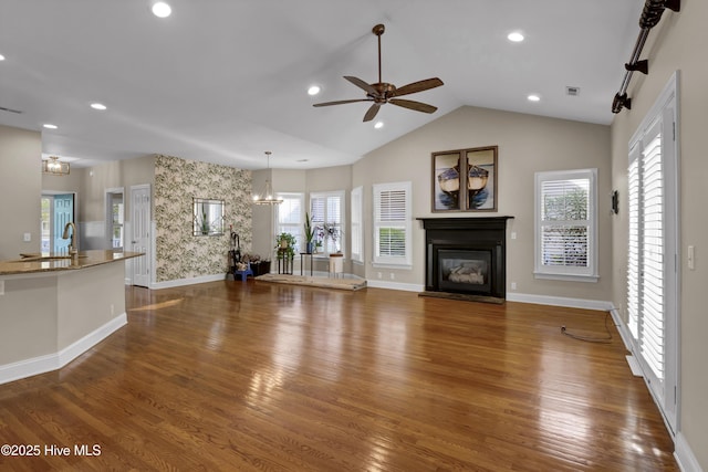5622 Shell Road Village Dr, Wilmington, NC 28403 - unfurnished living room featuring ceiling fan, a glass covered fireplace, dark wood-style floors, baseboards, and recessed lighting