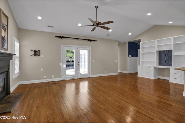 5622 Shell Road Village Dr, Wilmington, NC 28403 - unfurnished living room with ceiling fan, vaulted ceiling, a glass covered fireplace, wood finished floors, and baseboards