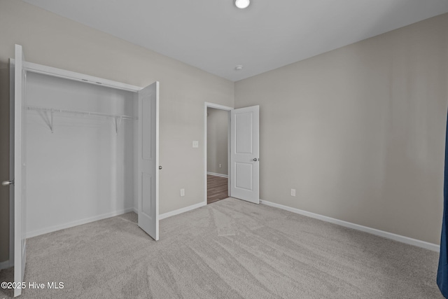 1008 Rodanthe Dr, New Bern, NC 28562 - unfurnished bedroom with carpet, a closet, and baseboards