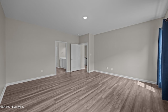 1008 Rodanthe Dr, New Bern, NC 28562 - unfurnished bedroom featuring wood finished floors, baseboards, and recessed lighting