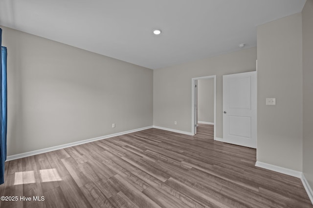 1008 Rodanthe Dr, New Bern, NC 28562 - empty room featuring dark wood-style floors, baseboards, recessed lighting, and a smoke detector