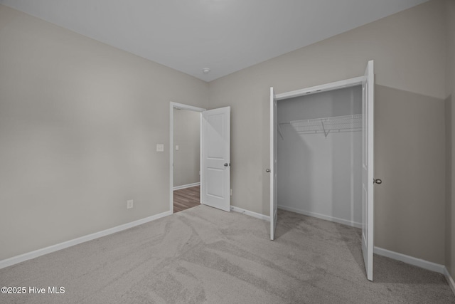 1008 Rodanthe Dr, New Bern, NC 28562 - unfurnished bedroom featuring carpet, baseboards, and a closet