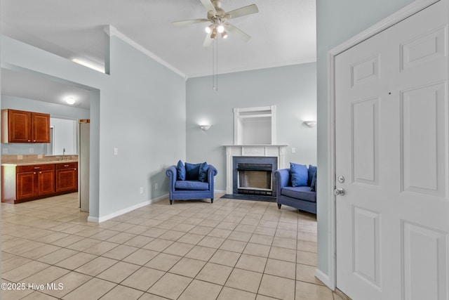 1001 Windgate Dr, Wilmington, NC 28412 - living area with ornamental molding, a fireplace, a ceiling fan, light tile patterned flooring, and baseboards