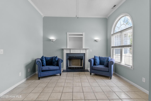 1001 Windgate Dr, Wilmington, NC 28412 - living area featuring ornamental molding, a fireplace, healthy amount of natural light, light tile patterned floors, and baseboards