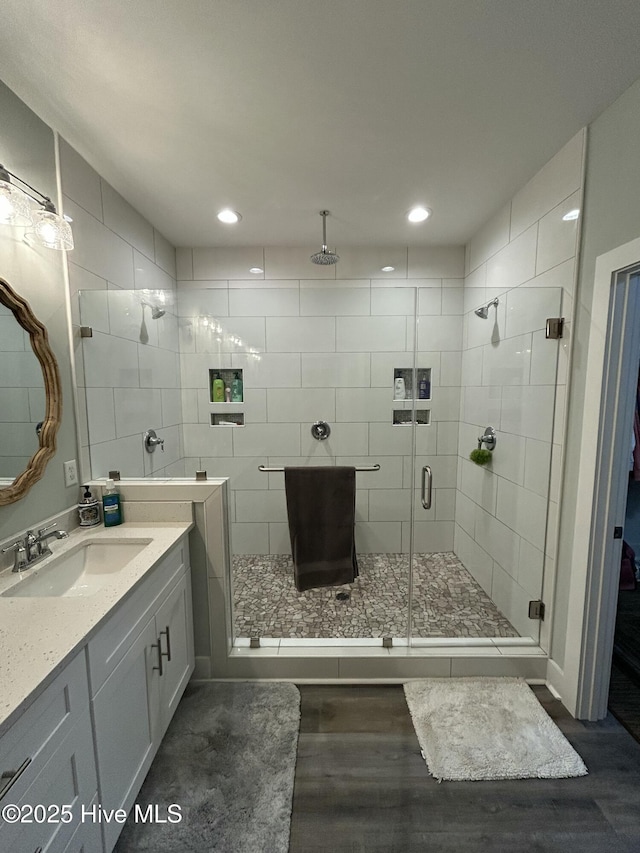 429 Island Creek Rd, Rocky Point, NC 28457 - bathroom with vanity, wood finished floors, a shower stall, and recessed lighting