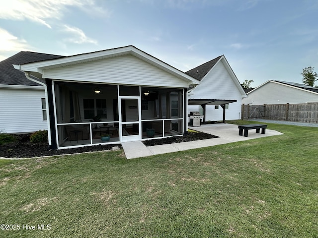429 Island Creek Rd, Rocky Point, NC 28457 - back of property with a sunroom, a patio area, and roof with shingles
