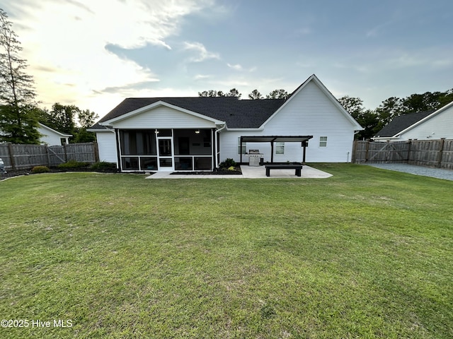 429 Island Creek Rd, Rocky Point, NC 28457 - rear view of house featuring a sunroom, a patio area, and a shingled roof