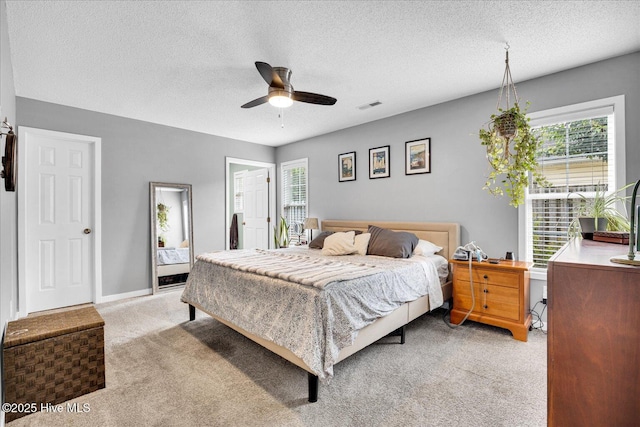 222 Bridgeton Ct, Wilmington, NC 28411 - bedroom featuring light colored carpet, a textured ceiling, and ceiling fan
