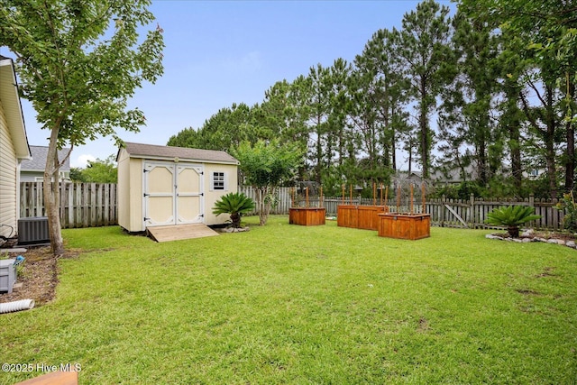 222 Bridgeton Ct, Wilmington, NC 28411 - view of yard featuring central AC unit and a vegetable garden
