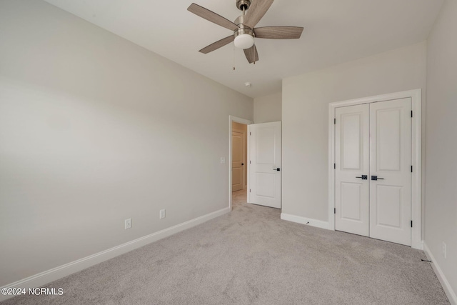 2117 Kali Ln Unit A, Greenville, NC 27834 - unfurnished bedroom featuring carpet flooring, baseboards, a closet, and a ceiling fan