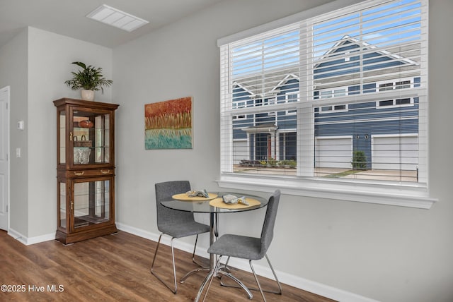 6751 Blacktip Ln, Wilmington, NC 28412 - dining room featuring baseboards and wood finished floors