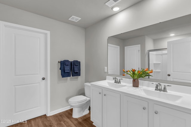 6751 Blacktip Ln, Wilmington, NC 28412 - bathroom with wood finished floors, double vanity, and a shower